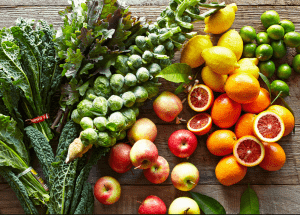 a group of fruits and vegetables on a wood surface Healthy Weight Loss Diets Redditch