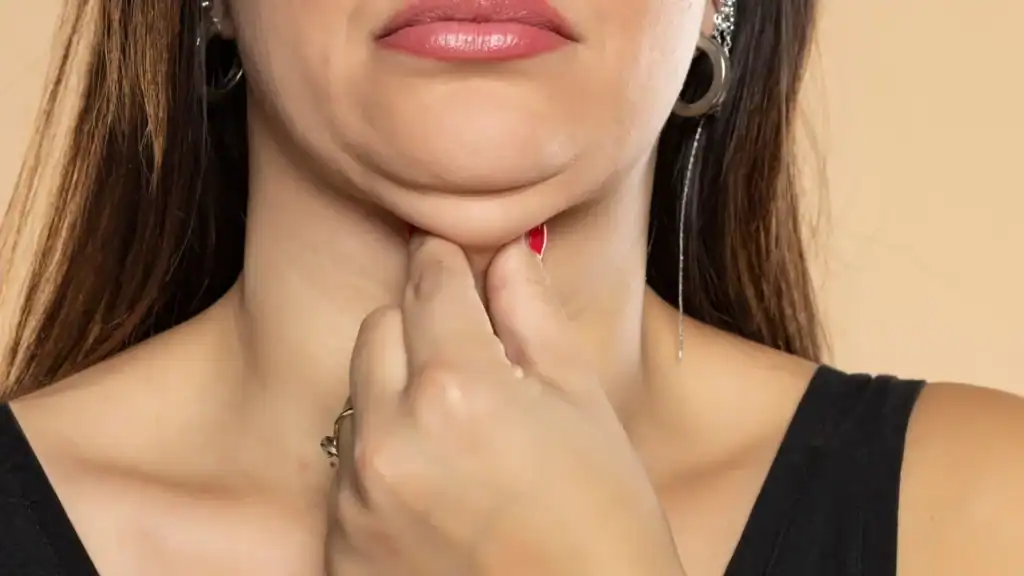 An image of a woman with double chin, sad, worried : Non Surgical Double Chin Removal Treatment in Redditch, UK